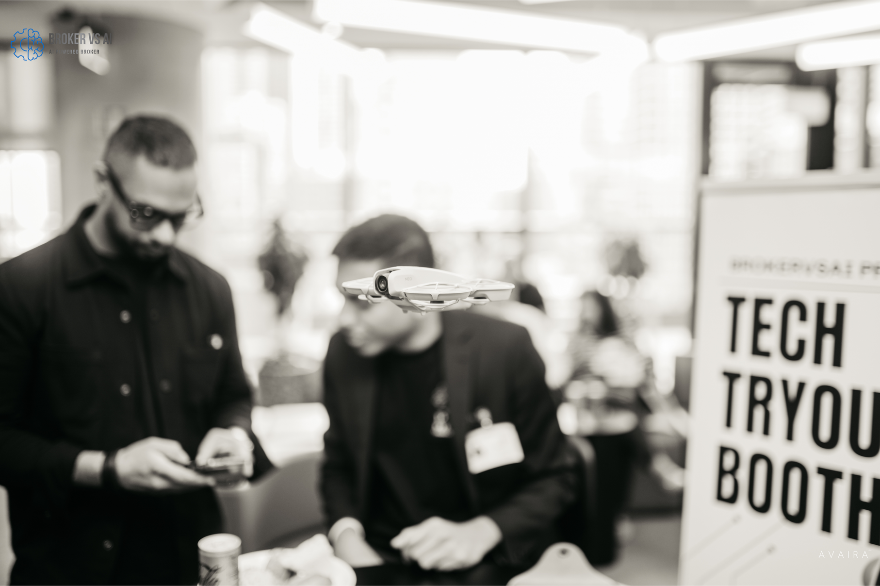 Tech demonstration booth with interactive AI tools and attendees