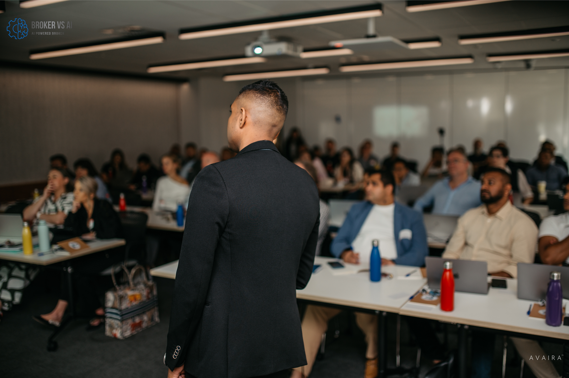 Workshop session with presenter addressing engaged audience